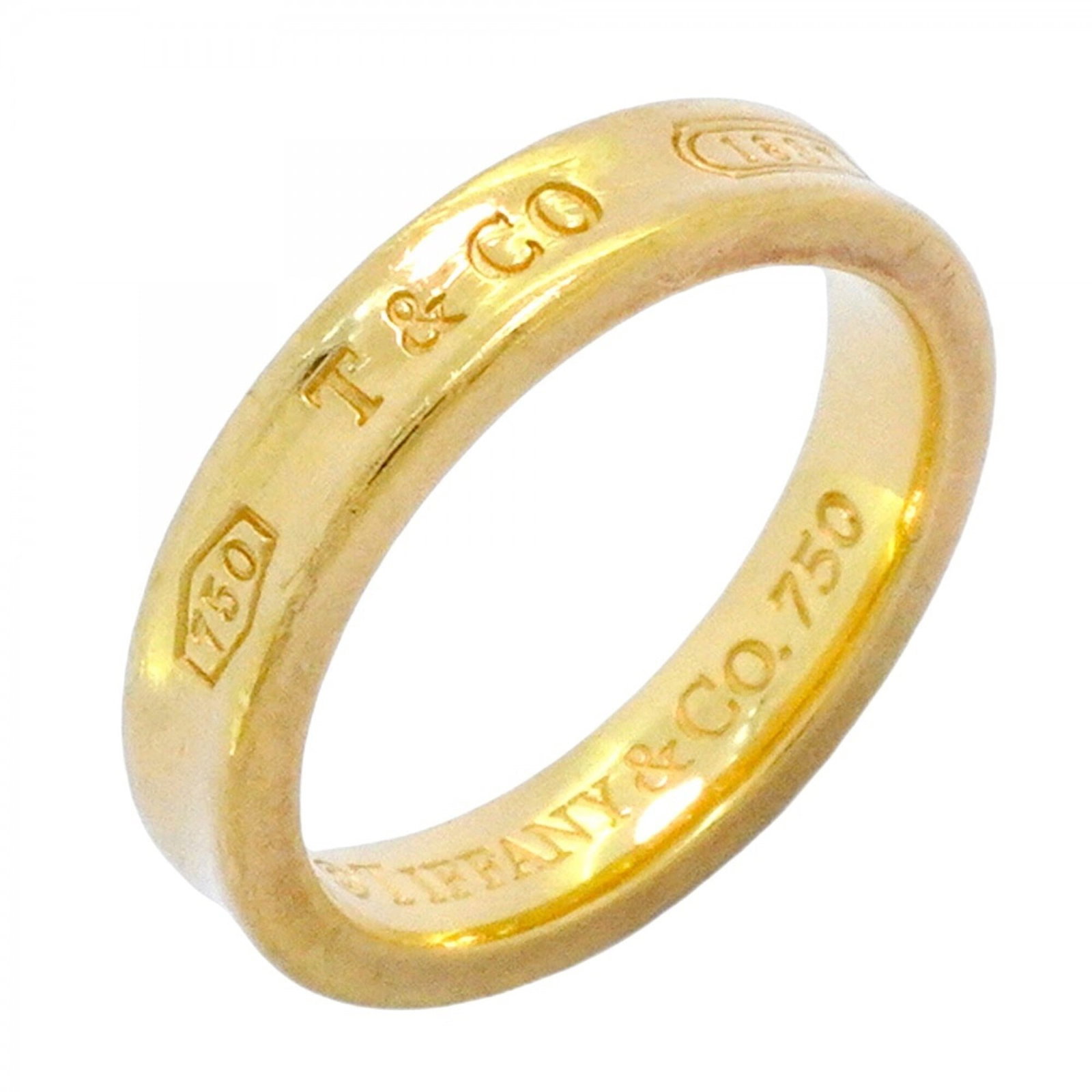 Tiffany gold ring band yellow: Tiffany gold ring band yellow Yellow gold (18K) Tiffany band ring, available in US size 6 and JP size 11. This elegant ring features a classic design with a yellow gold finish that adds a touch of