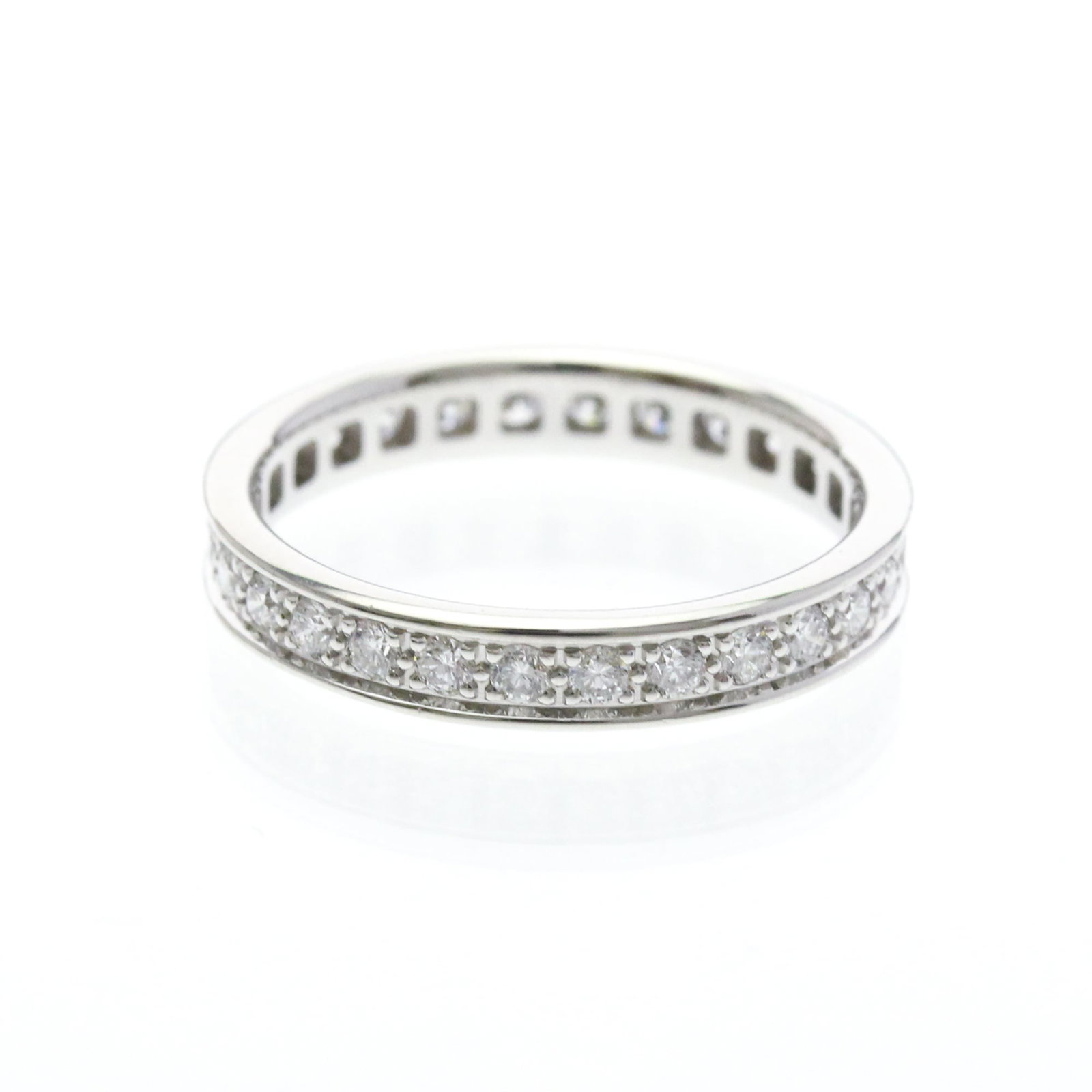 Gold White Ring Cartier Band: Gold White Ring Cartier Band The Cartier Band features an elegant full eternity ring design in white gold, adorned with diamonds. This timeless piece boasts a classic style that suits both men and