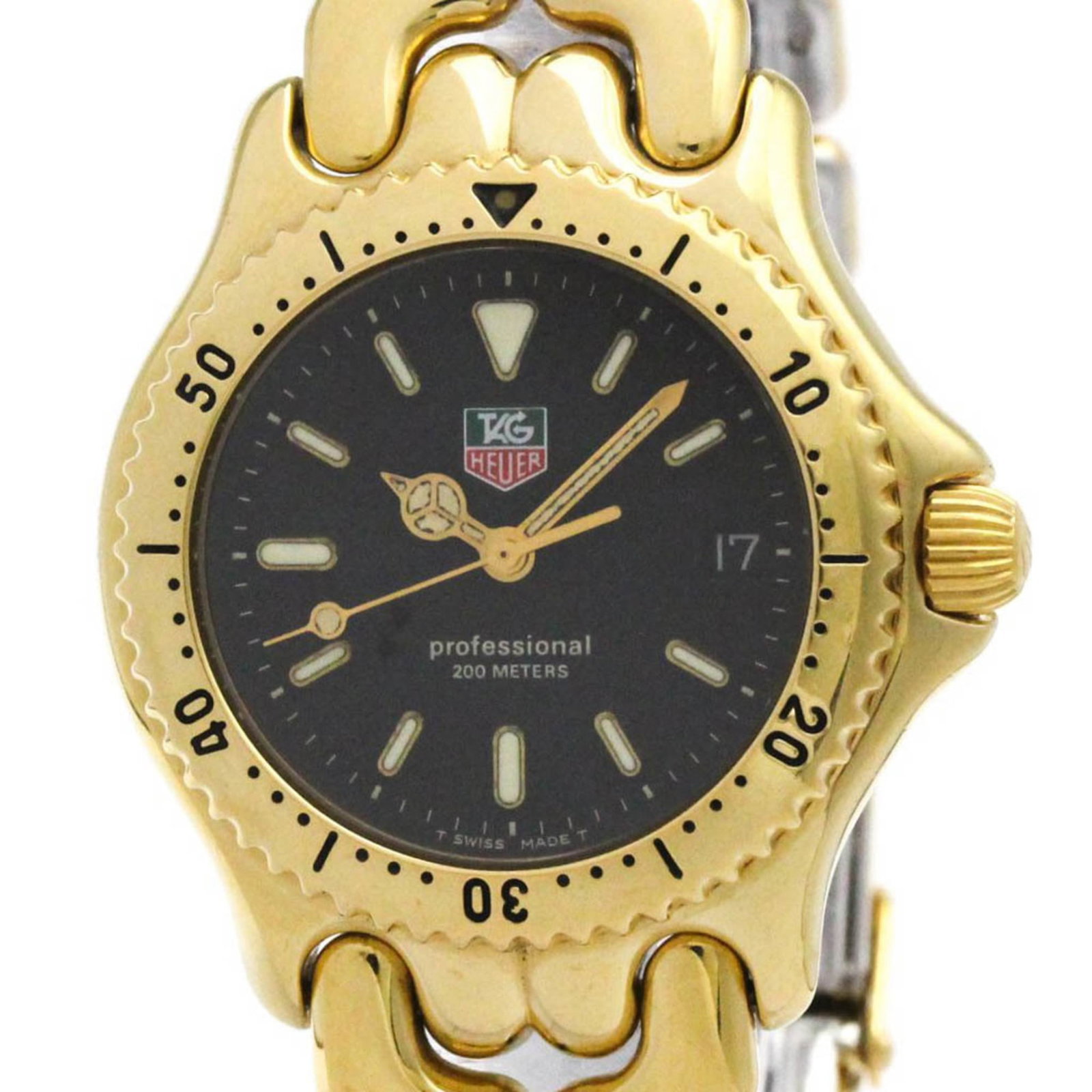 Wristwatch From Tag: Wristwatch From Tag The Tag Heuer S94.313M wristwatch boasts a sleek design with a gold plated, stainless steel case and band, complemented by a black dial. This sporty timepiece features a quartz