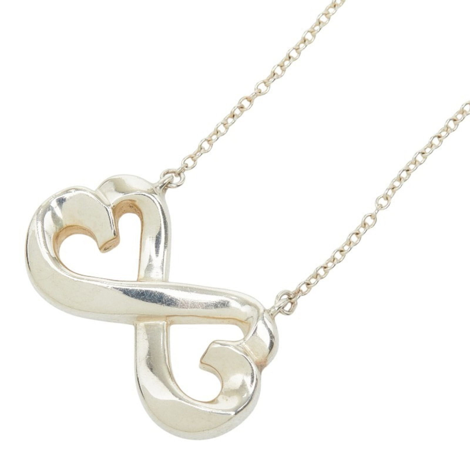 Women's heart necklace silver Sv925 by Tiffany & Co.: Women's heart necklace silver Sv925 by Tiffany & Co. Silver 925 by Tiffany & Co. features a heart-shaped pendant, measuring 13.3mm x 21.7mm. The necklace's silver material and 45 cm circumference