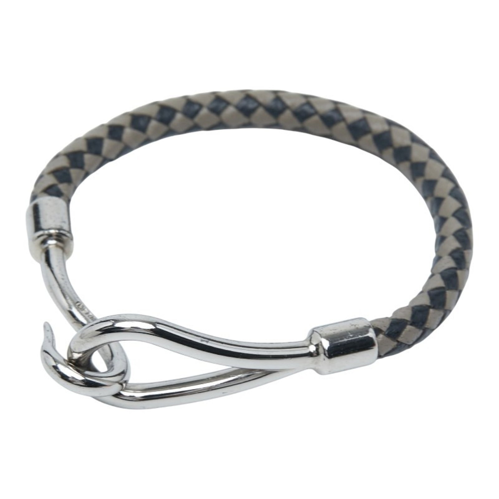 Metal leather bracelet charm by Hermes: Metal leather bracelet charm by Hermes Black and silver metal leather charm by Hermes, measuring 14.5cm in length, adds a touch of elegance to any outfit with its sleek design. The combination of