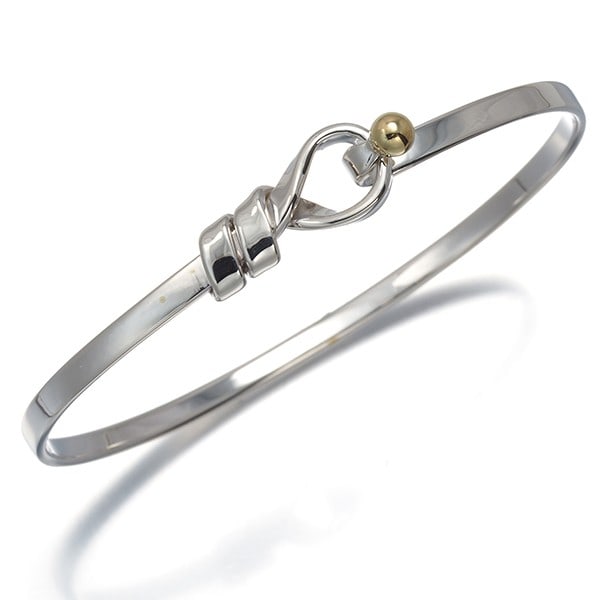 Tiffany&Co. Bracelet Love Knot Bangle Silver 925/ 18K Yg: Tiffany&Co. Bracelet Love Knot Bangle Silver 925/ 18K Yg Sterling silver and 18K yellow gold combine in the elegant Love Knot Bangle from Tiffany&Co. This bangle features a classic design with a hook