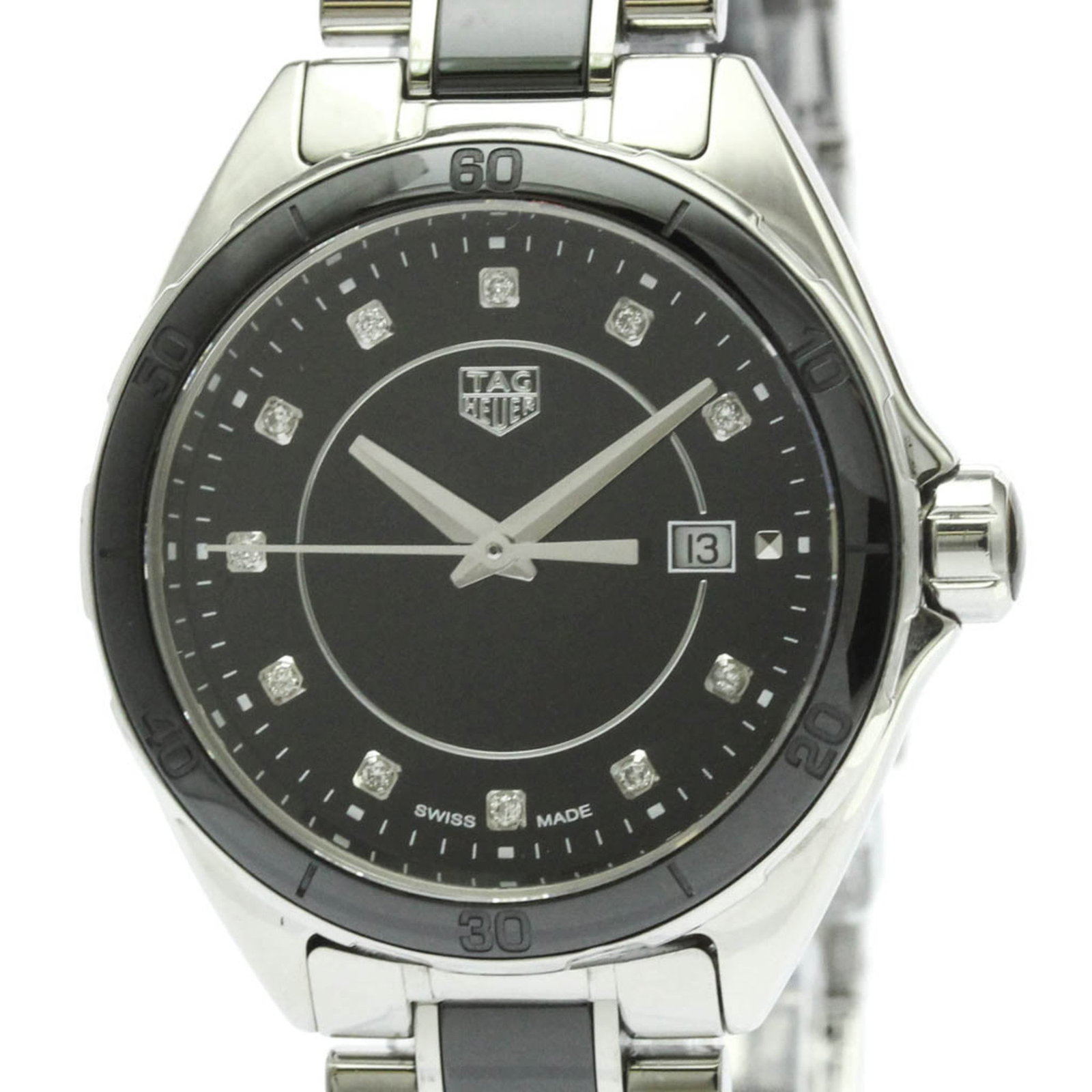 Wristwatch From Tag: Wristwatch From Tag Stainless steel case and ceramic band make for a sleek, sporty design. This black-dialled Formula 1 watch from Tag Heuer features a quartz movement and date display, making it a