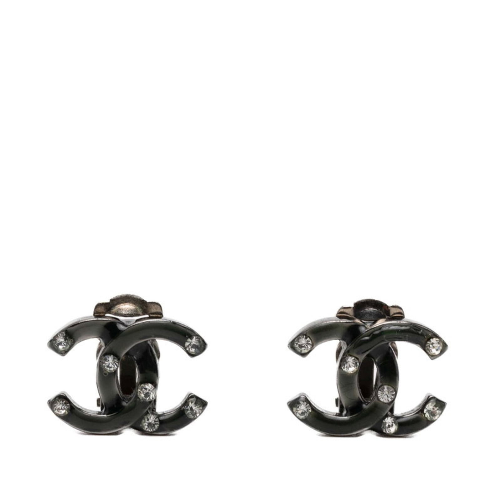 Rhinestone metal clip earrings by Chanel: Rhinestone metal clip earrings by Chanel Chanel's rhinestone metal clip earrings boast a striking green hue and sleek silver finish, adding a touch of glamour to any outfit. Measuring 12.90mm x 17.30m