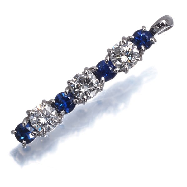 Diamond 0.599Ct Sapphire 0.53Ct Pendant 900 Platinum: Diamond 0.599Ct Sapphire 0.53Ct Pendant 900 Platinum 900 Platinum Diamond Pendant with Natural Sapphire Accent. This striking pendant showcases a 0.599ct diamond surrounded by a delicate platinum sett
