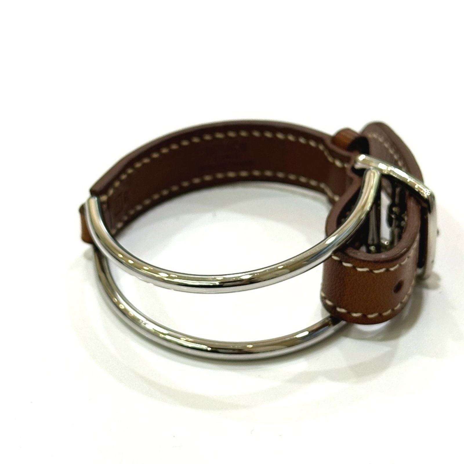 Metal leather bracelet charm by Hermes: Metal leather bracelet charm by Hermes Item Specifics: Brand: Hermes Country of Origin: France Type: Charm bracelet Gender: Women Material: Leather, Metal Color: Brown Length: 15cm - 17cm / 5.9'' -