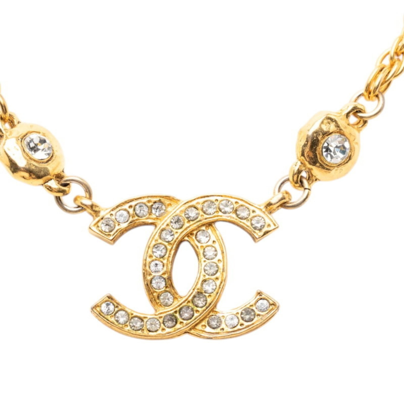 Women's gold plated rhinestone necklace chain pendant with Chanel Coco Mark.: Women's gold plated rhinestone necklace chain pendant with Chanel Coco Mark. The Chanel Coco Mark pendant necklace features a gold plated chain and rhinestone design, showcasing the iconic brand's