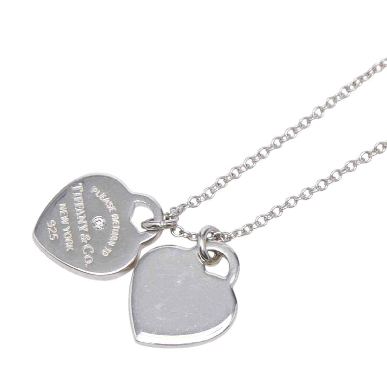 Tiffany Return To Double Heart Tag With 1 Diamond Necklace In 925 Sterling Silver For Women.: Tiffany Return To Double Heart Tag With 1 Diamond Necklace In 925 Sterling Silver For Women. Tiffany's Return to Double Heart Tag necklace showcases a stunning diamond pendant set in 925 sterling