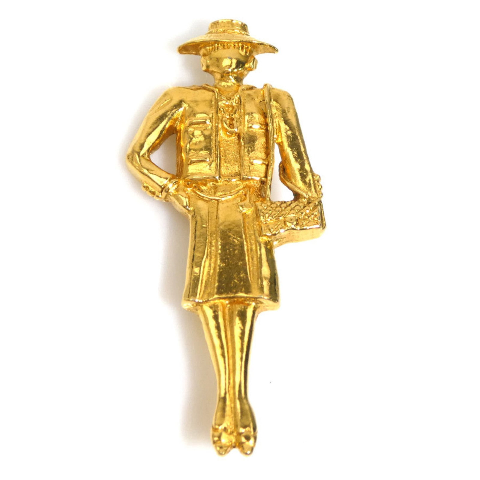 Metal Chanel Brooch: Metal Chanel Brooch The metal Chanel brooch boasts its French origin and gold material, measuring 6cm x 2.5cm in size. Bearer of a notable signature, this piece showcases the brand's iconic style