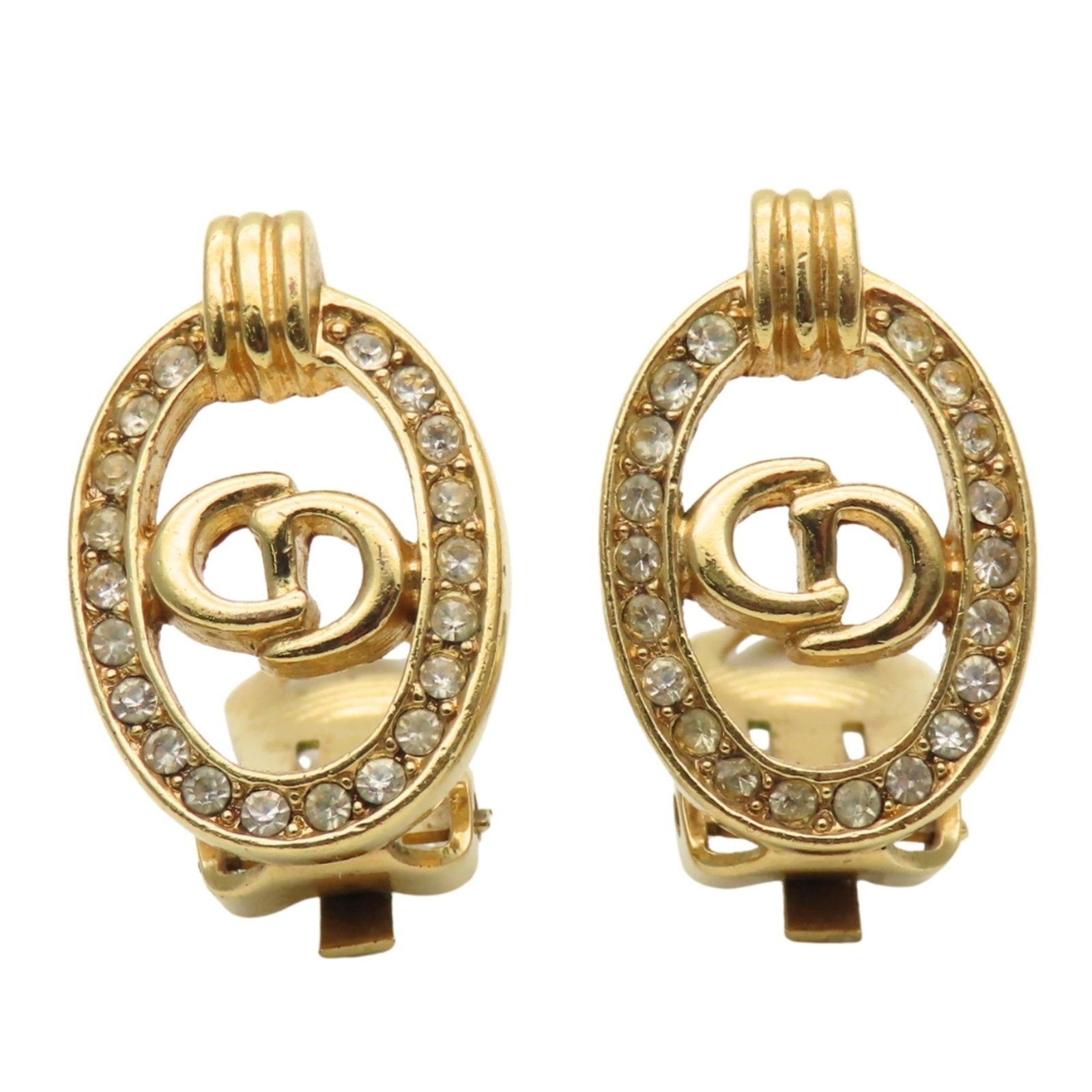Christian Dior Clip Earrings Metal: Christian Dior Clip Earrings Metal Gold Rhinestone Clip Earrings from Christian Dior, measuring 21.50mm x 14.10mm and weighing 6.7g, feature a striking metal design adorned with rhinestones. The
