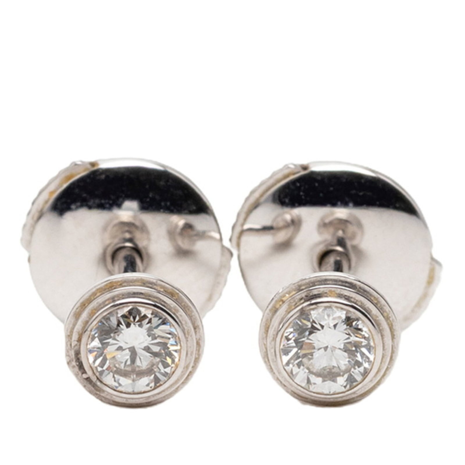 Gold Cartier Stud White Earrings: Gold Cartier Stud White Earrings White gold (18K) Cartier stud earrings with a silver finish, measuring 5.10mm in diameter and weighing approximately 0.20'' x 0.20''. The elegant design bears the sign