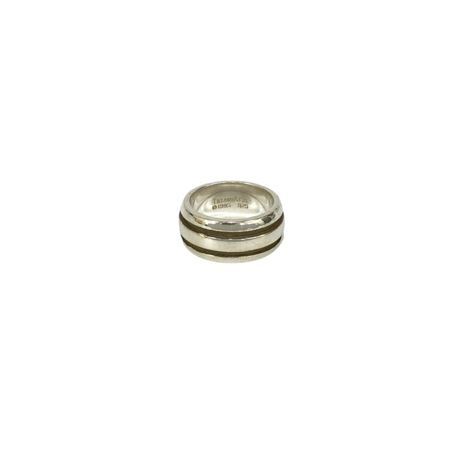 Silver 925 Tiffany Band Ring: Silver 925 Tiffany Band Ring Silver 925 Tiffany Band Ring features a sleek band design made from high-quality silver material, bearing the hallmark of Tiffany's craftsmanship. This women's ring is