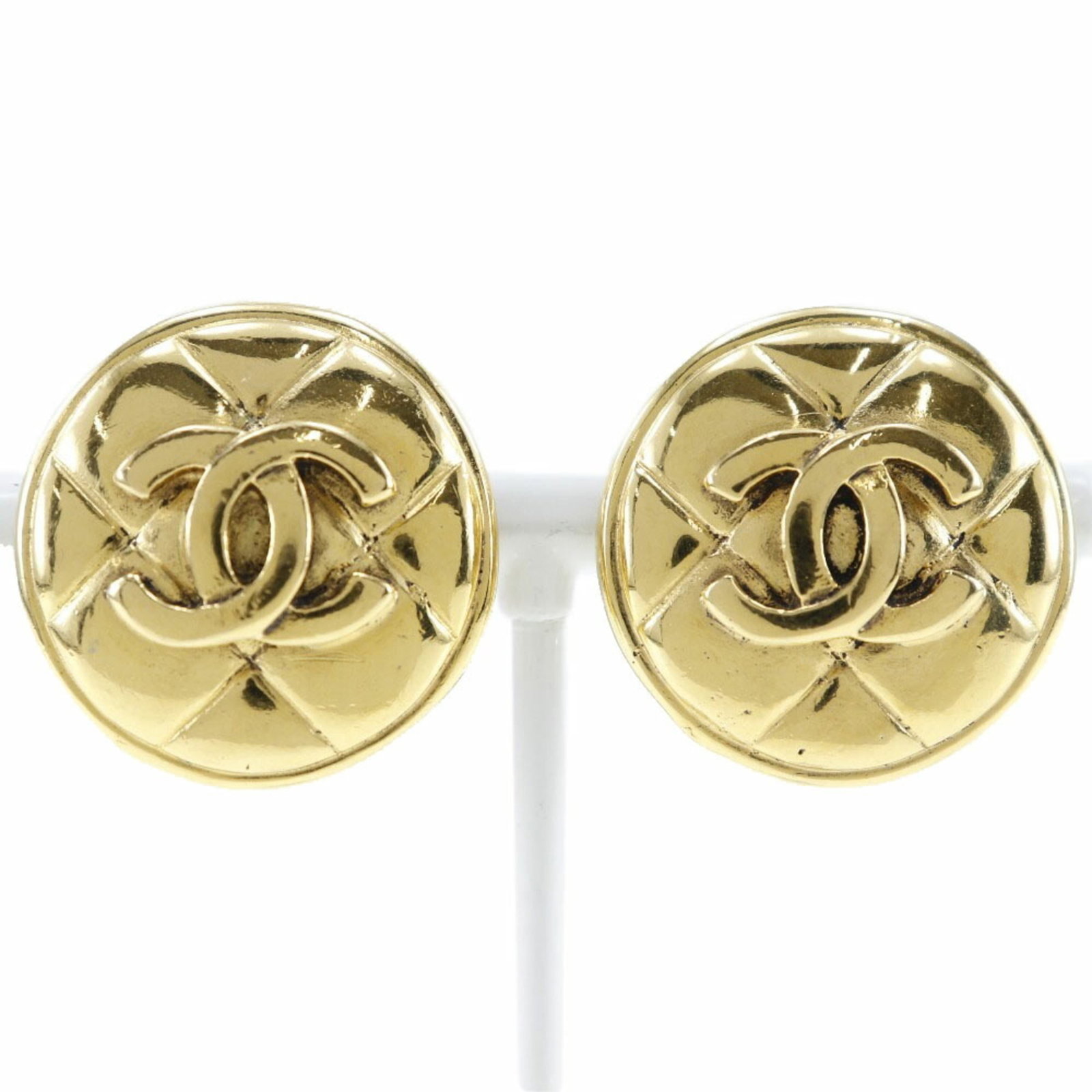 Clip earrings by Chanel: Clip earrings by Chanel Clip earrings by Chanel, crafted from gold plated metal with a classic Matelasse design. Made in France, these vintage clip earrings showcase a timeless elegance. Measuring