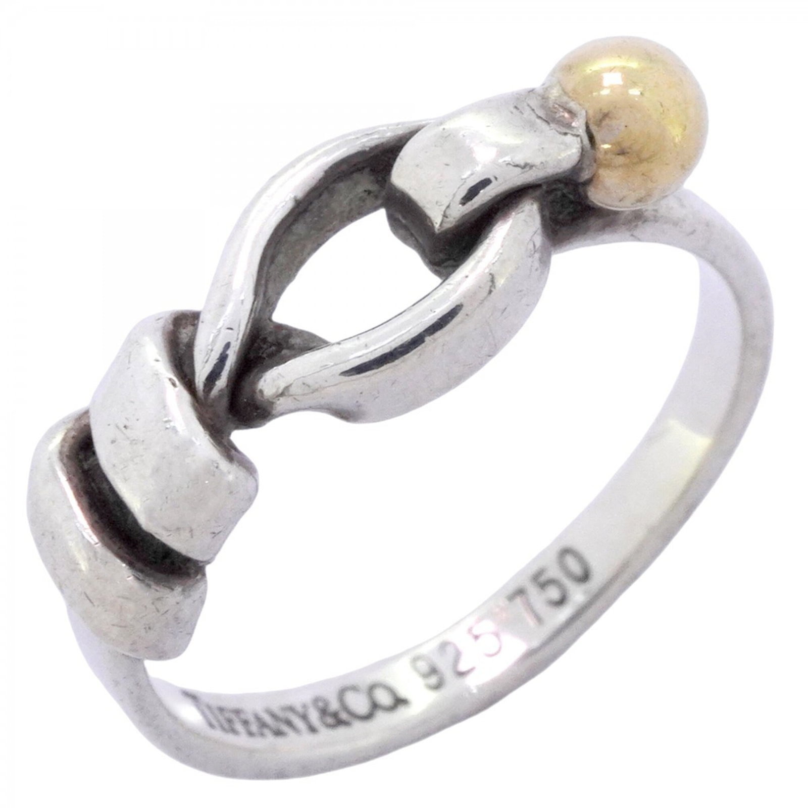Tiffany Band Ring Silver 925 Yellow Gold (18K): Tiffany Band Ring Silver 925 Yellow Gold (18K) Silver 925 and yellow gold (18K) combine in this elegant Tiffany band ring, available in US size 6 and Japanese size 11. The striking design features a s