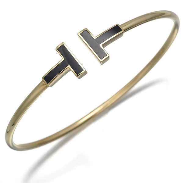 Tiffany Co Yellow Gold 18k Onyx Bangle Wire Tiffany Bracelet: Tiffany Co Yellow Gold 18k Onyx Bangle Wire Tiffany Bracelet Yellow Gold 18k Onyx Bangle Wire Tiffany Bracelet, featuring a natural onyx stone set in 18k yellow gold wire, with an inner circumference 
