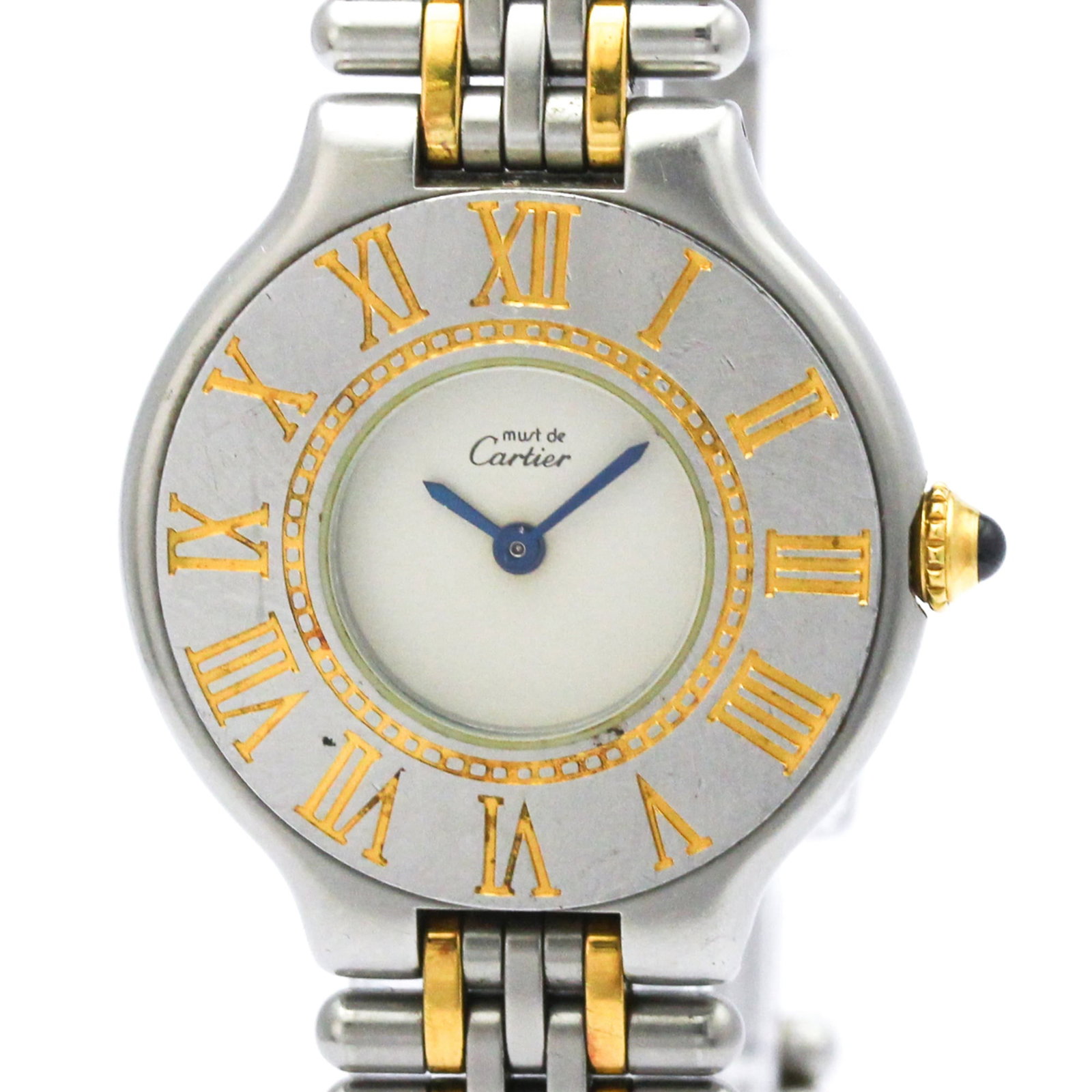 Wristwatch By Cartier: Wristwatch By Cartier Gold plated, stainless steel case and band complement the elegant silver dial of this Cartier Must 21 wristwatch. With its sleek 28mm design and quartz movement, this