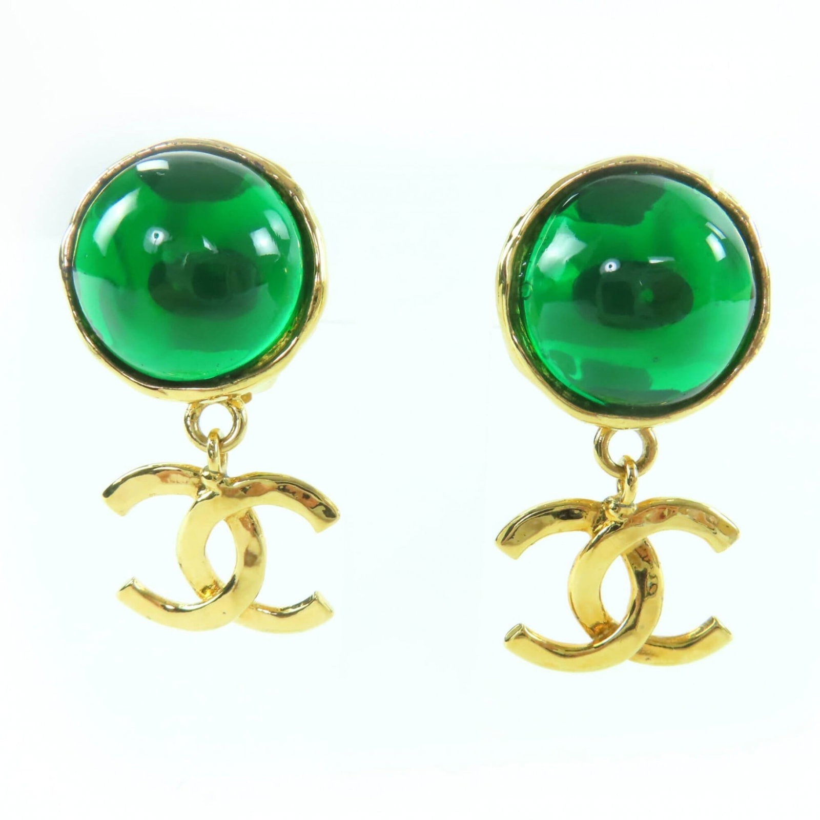 Clip earrings by Chanel: Clip earrings by Chanel Clip earrings by Chanel, crafted in gold and green hues, measure 40.00mm x 20.00mm in size. Made from a luxurious material, these clip earrings showcase the iconic style of