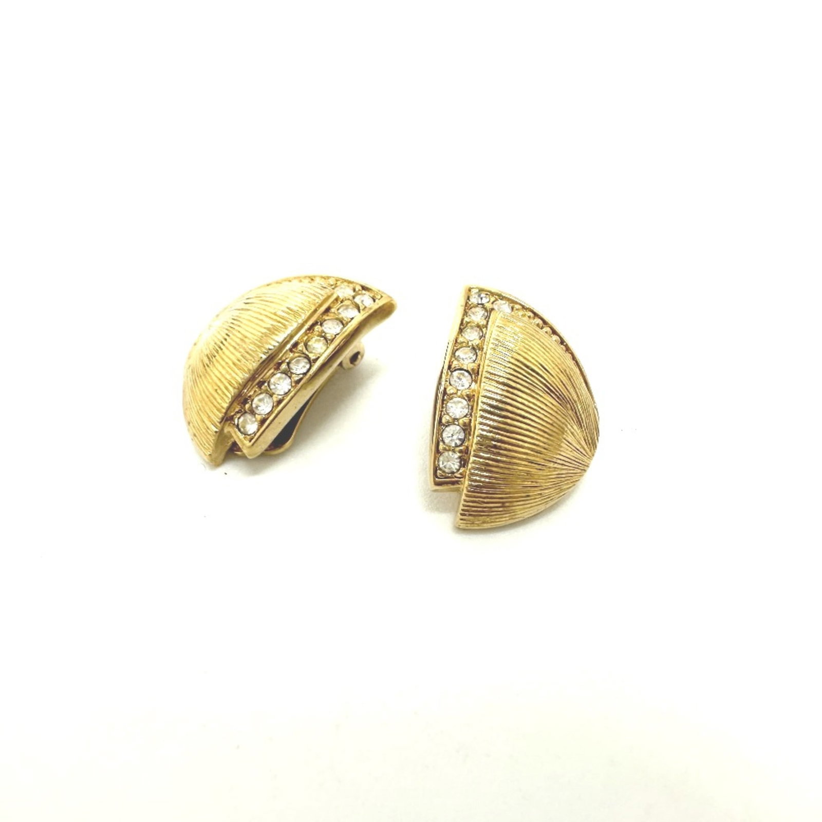 Plated Gold Christian Dior Clip Earrings: Plated Gold Christian Dior Clip Earrings Gold plated clip earrings from Christian Dior, featuring a 20mm x 14mm design with a luxurious gold finish. These elegant earrings showcase the iconic brand's