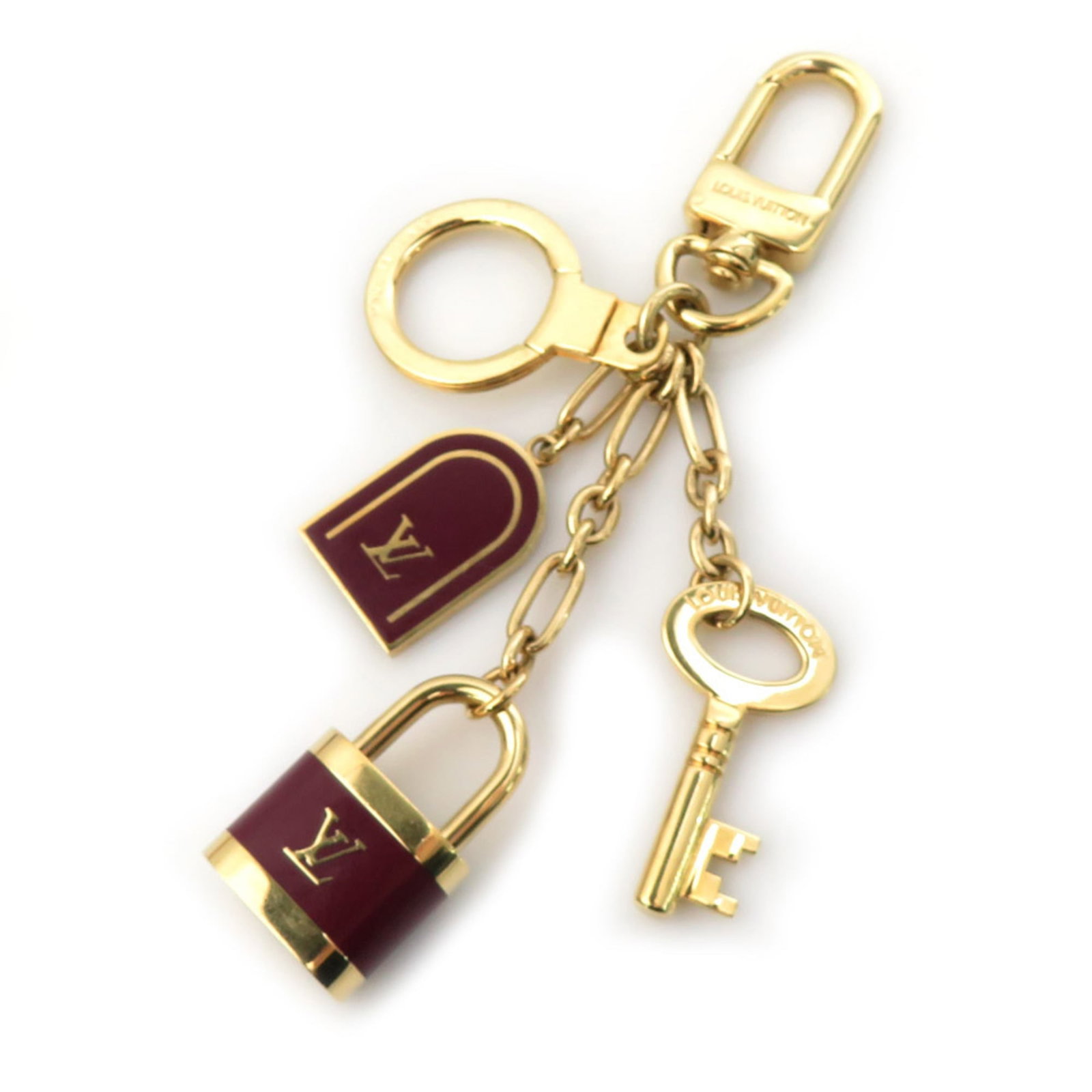 Handbag Charm Enamel Metal By Hermes: Handbag Charm Enamel Metal By Hermes Bordeaux and gold come together in this elegant handbag charm, showcasing the iconic colors of Hermes. Made from enamel and metal, it bears a signature that adds t