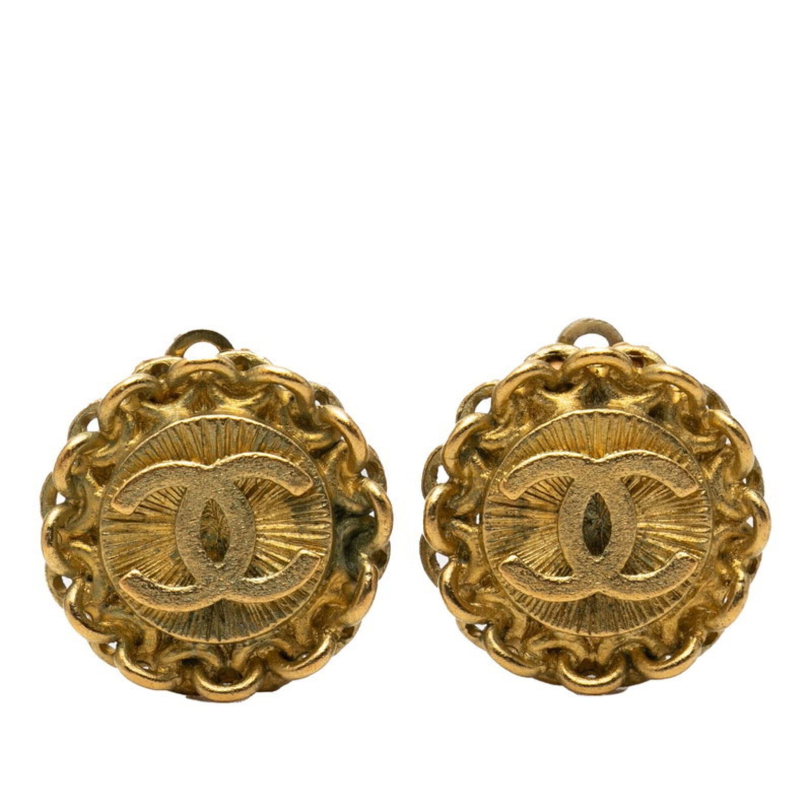 Clip earrings by Chanel: Clip earrings by Chanel Clip earrings by Chanel, crafted in gold, bear the signature of the renowned fashion house. Measuring 17.80mm x 17.80mm, these elegant drop earrings are a testament to
