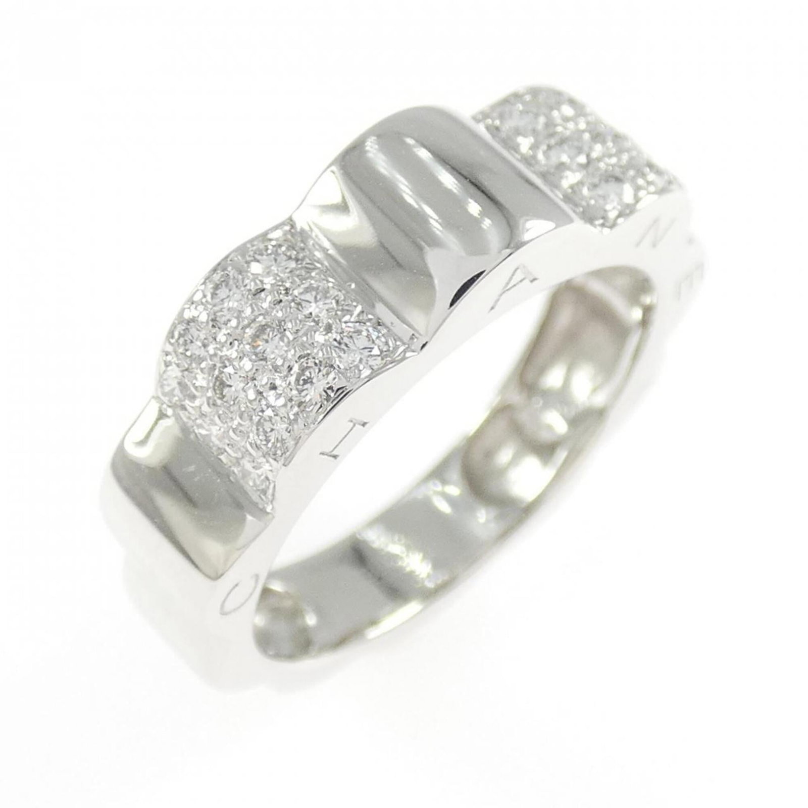 Chanel Band Ring White Gold (18K): Chanel Band Ring White Gold (18K) This 18K white gold band ring from Chanel's Camellia line features a diamond stone and measures 5.8mm in width, weighing 5g. The ring is available in US size 6 and