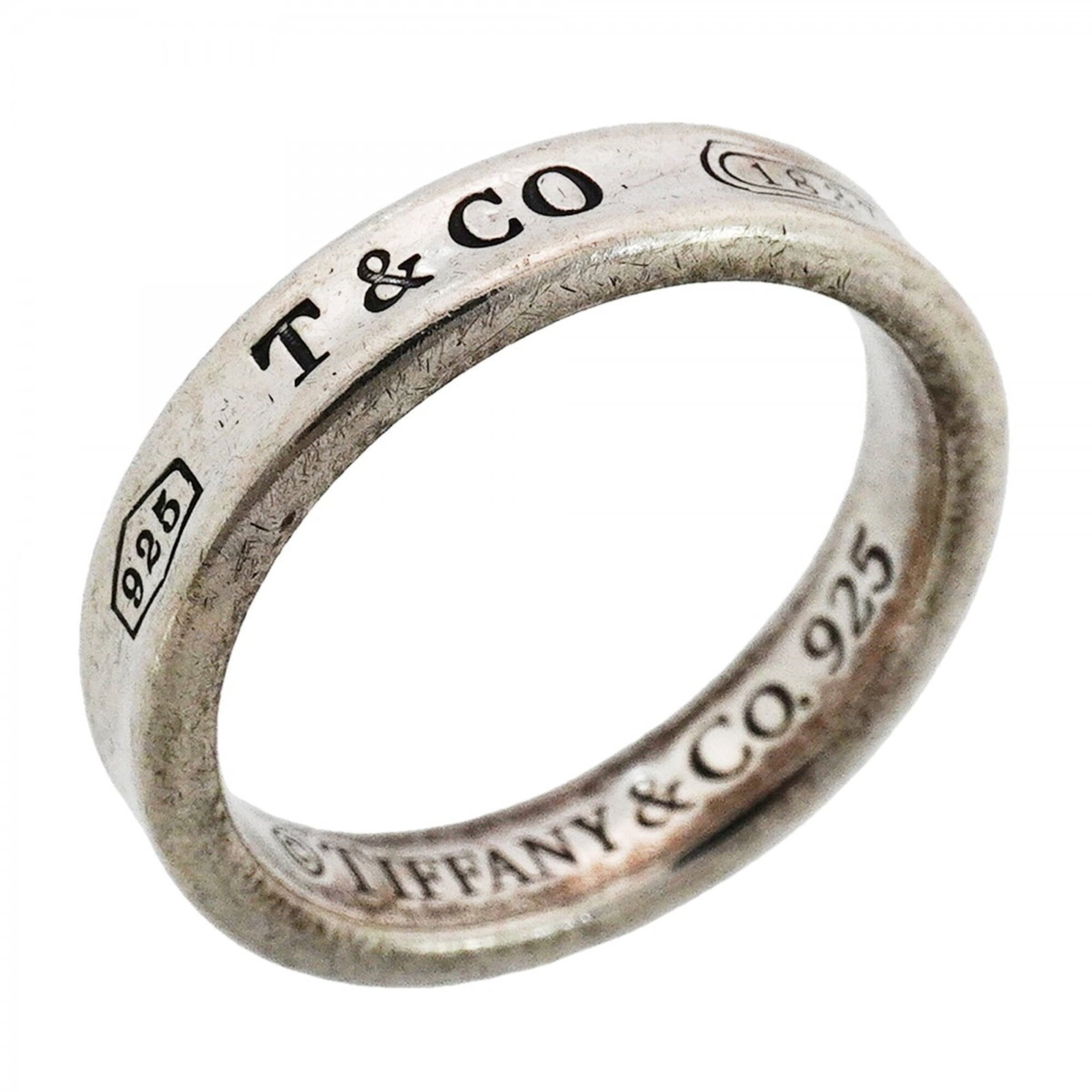 Silver 925 Tiffany Band Ring: Silver 925 Tiffany Band Ring Silver 925 Tiffany Band Ring features a classic design with a silver 925 material and US size 5, suitable for women. The ring bears the JP size 9 marking, indicating its