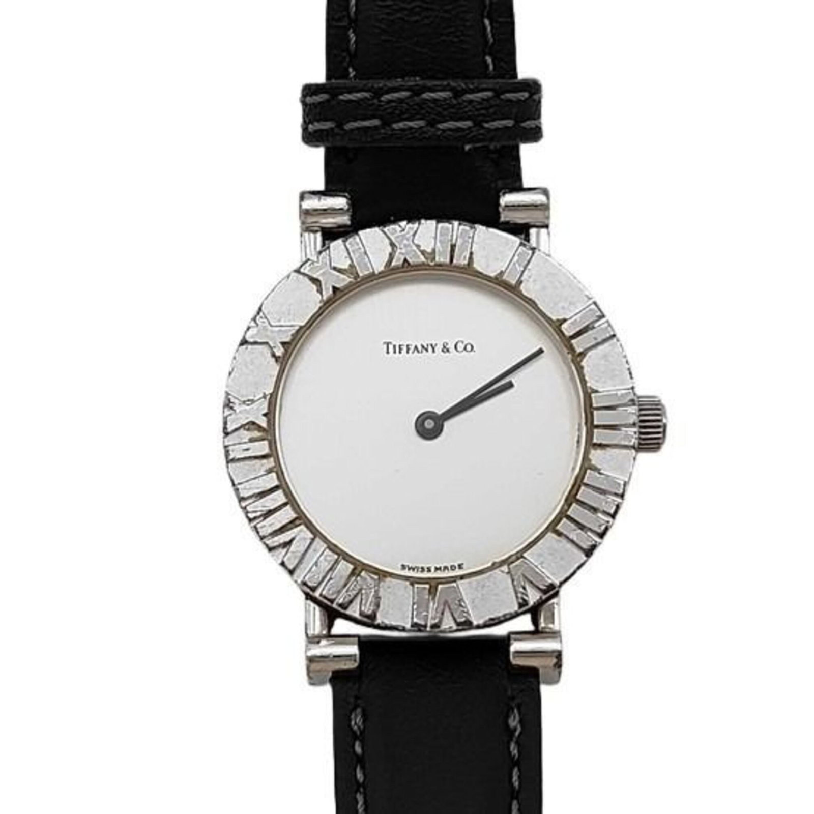 Tiffany Wristwatch: Tiffany Wristwatch Silver Tiffany wristwatch with a leather band, featuring a quartz movement and a diameter of 24mm. This elegant timepiece boasts a classic design that suits wrists ranging from