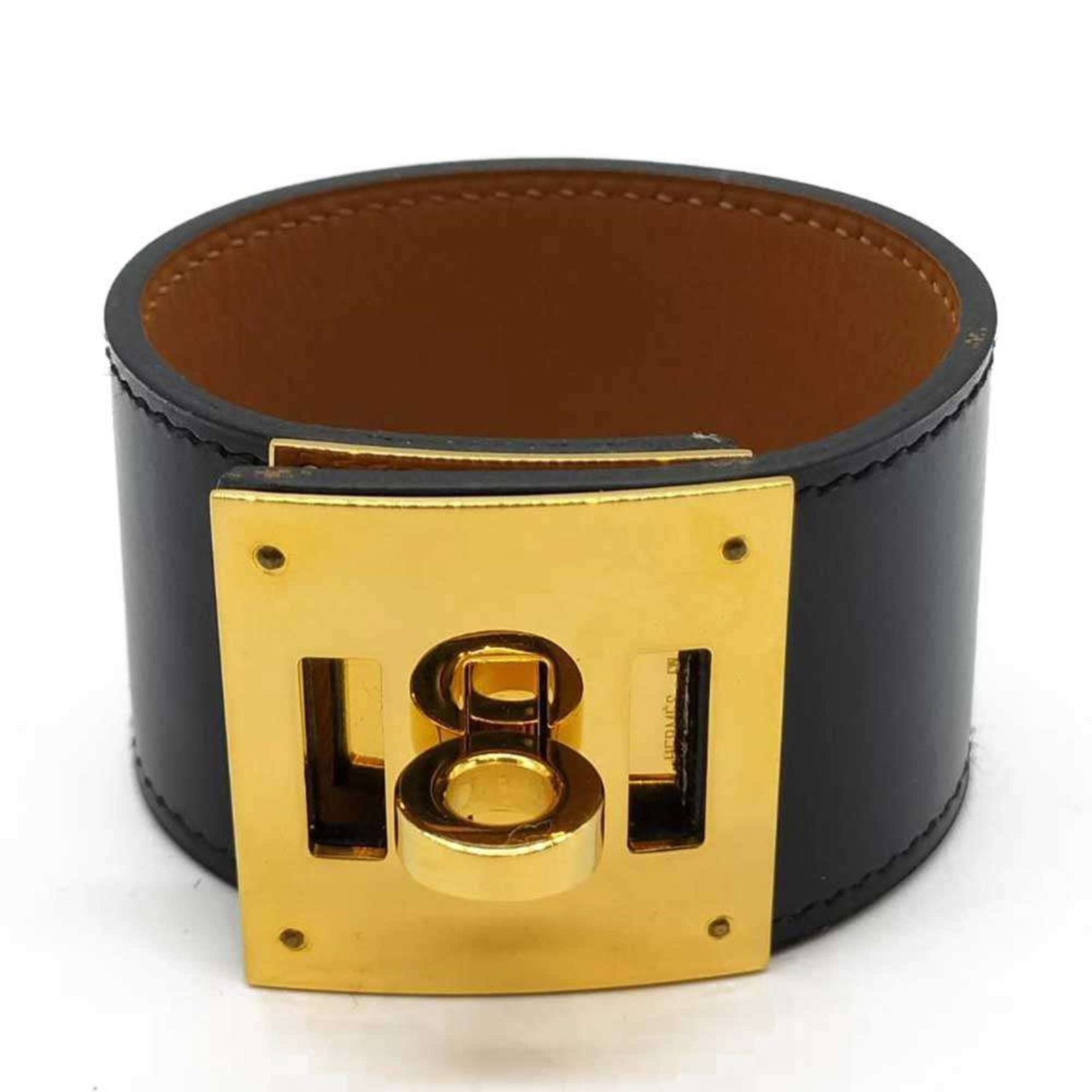 Calf leather box bangle Hermes: Calf leather box bangle Hermes Box calf leather bangle from Hermes, available in black and measuring 14cm-15cm. This bangle showcases the signature style of the luxury brand, featuring high-quality bo