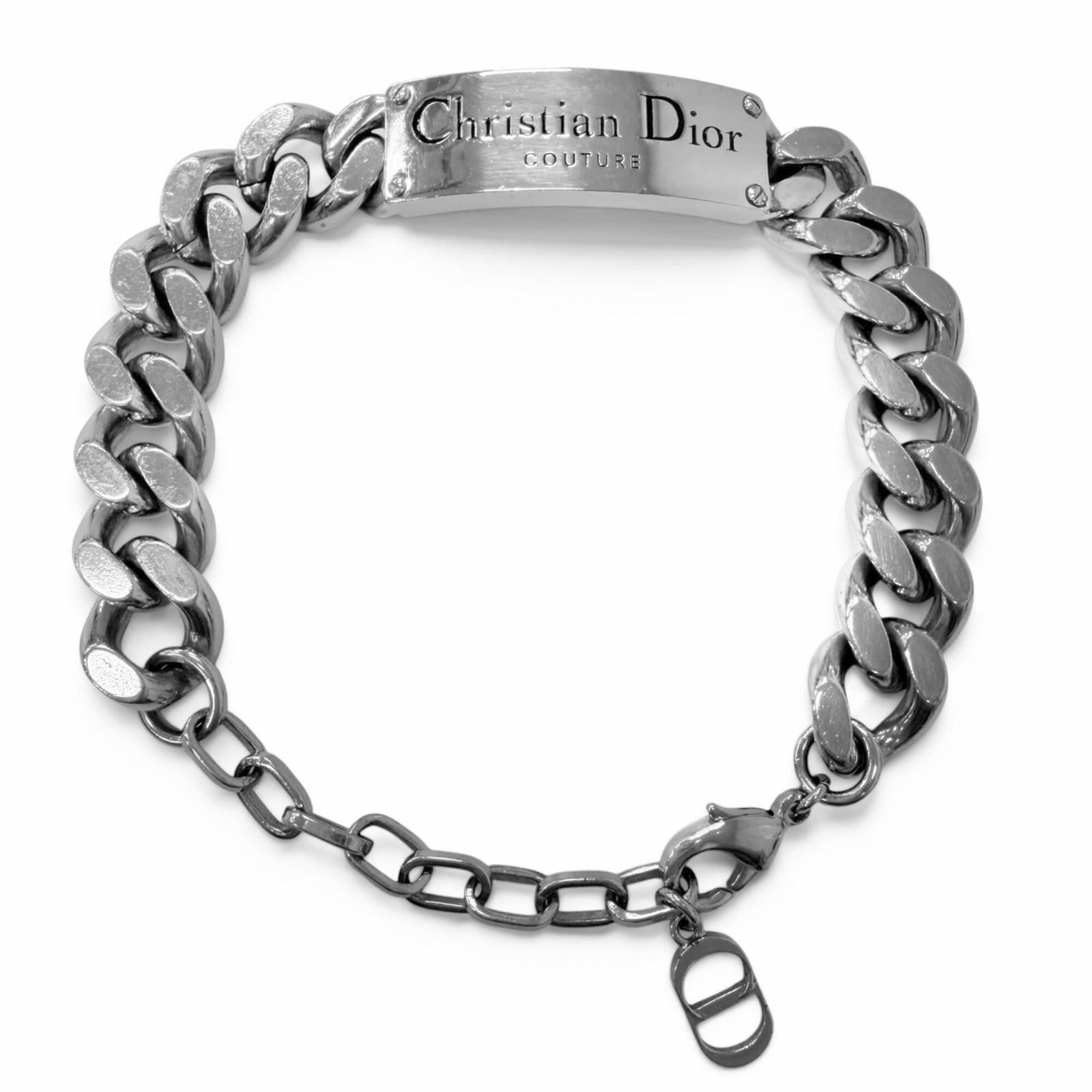 Christian Dior Charm bracelet: Christian Dior Charm bracelet Silver Charm bracelet from Christian Dior, measuring 25cm in length. This charm bracelet features the iconic brand name and style, adding a touch of sophistication to