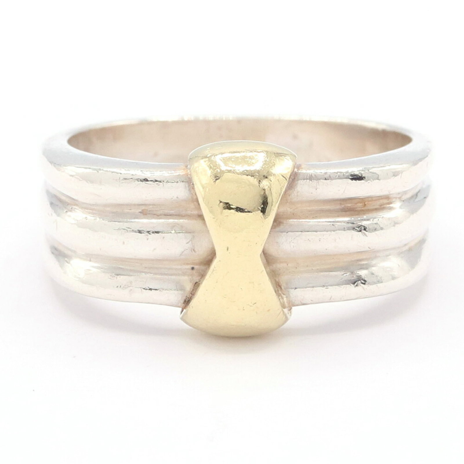 Sterling Silver 925 Yellow Gold Ring By Tiffany: Sterling Silver 925 Yellow Gold Ring By Tiffany Sterling silver 925 Yellow gold (18K) ring by Tiffany, featuring a classic band design with a US size 7 and JP size 14 fit. This elegant piece boasts a 