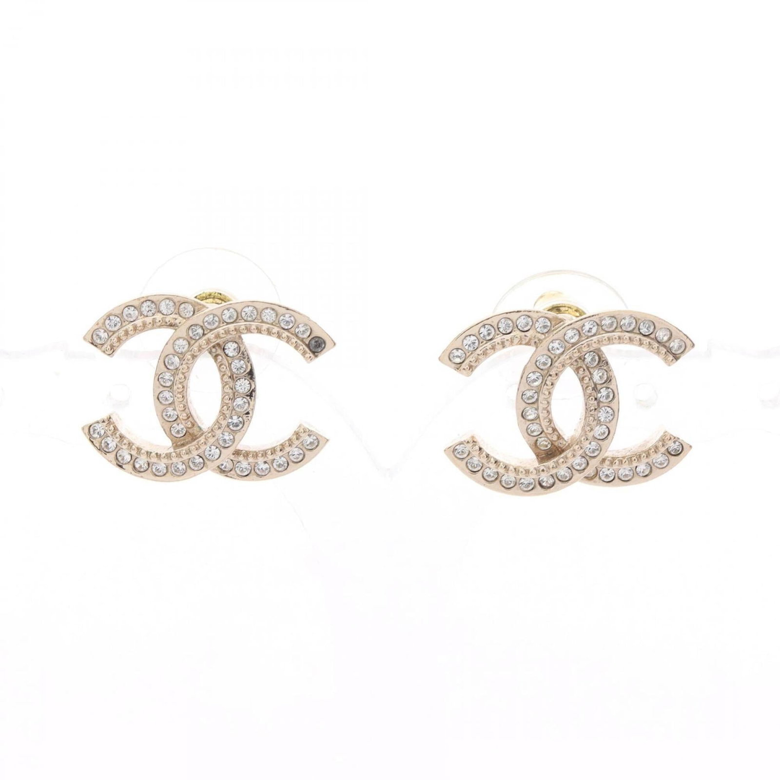 Chanel Stud Earrings Gold Plating Rhinestone: Chanel Stud Earrings Gold Plating Rhinestone Gold plating and clear rhinestones add a touch of luxury to these Chanel stud earrings, featuring a sleek and sophisticated design. Made from gold plating
