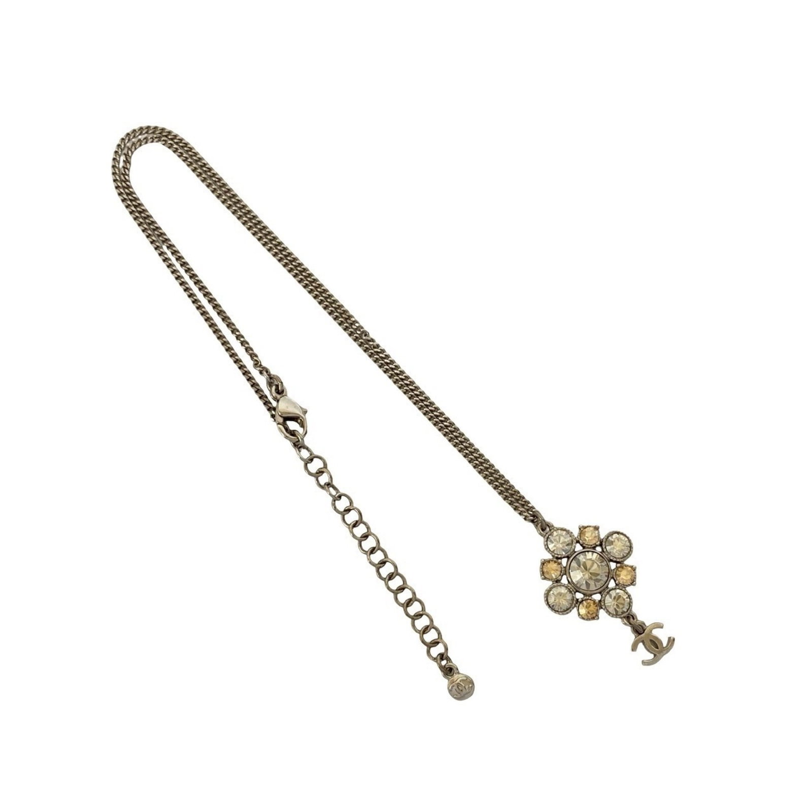 Coco Chanel Motif Necklace Pendant Rhinestone Plated Silver 78936: Coco Chanel Motif Necklace Pendant Rhinestone Plated Silver 78936 Silver rhinestone plated necklace pendant from the iconic Coco Chanel brand, featuring a 40mm x 25mm design. This stylish piece