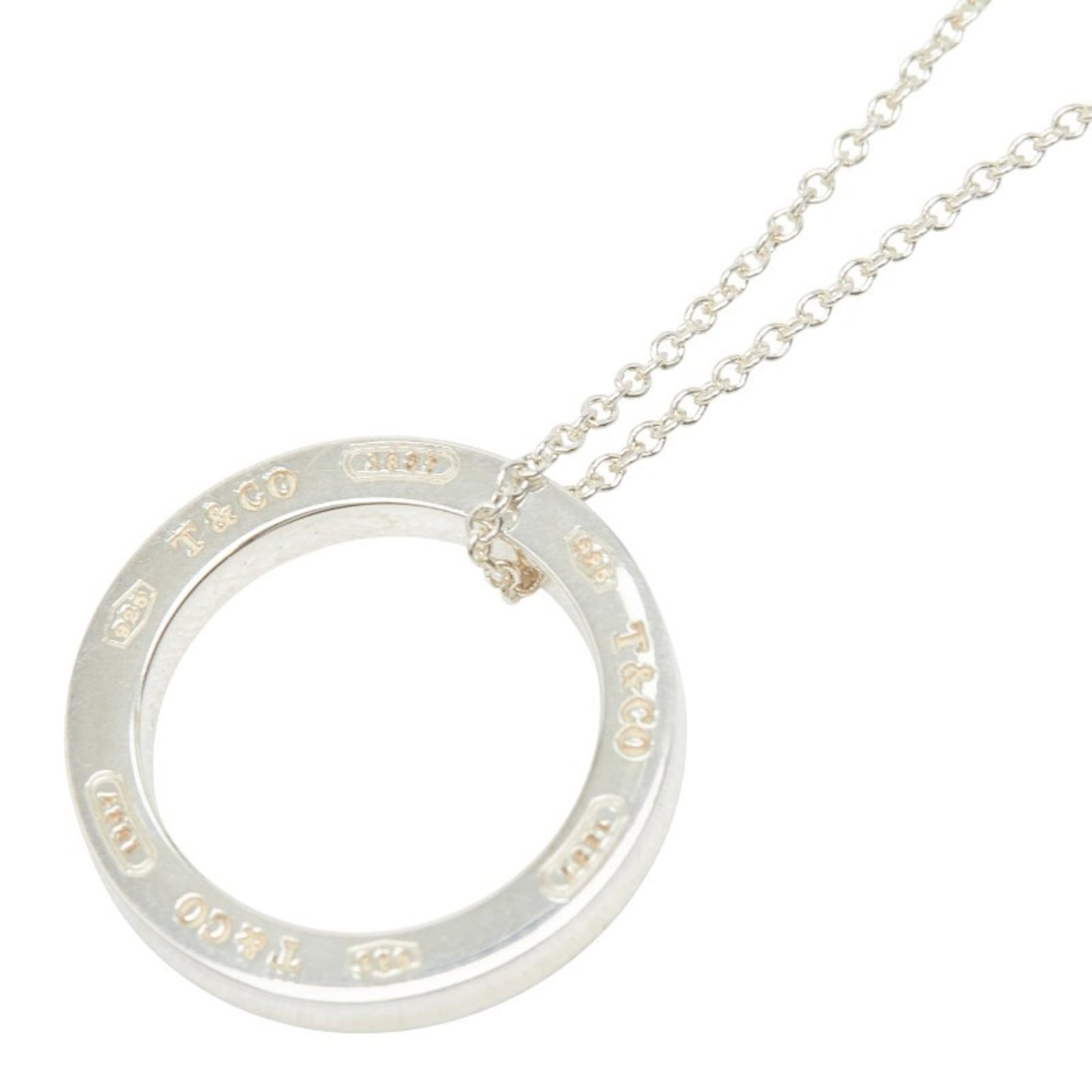 Tiffany 1837 Circle Ring Necklace In 925 Sterling Silver For Women. Tiffany & Co.: Tiffany 1837 Circle Ring Necklace In 925 Sterling Silver For Women. Tiffany & Co. Tiffany & Co.'s iconic Circle Ring Necklace in sterling silver, a timeless design that exudes elegance. This 925 sterl