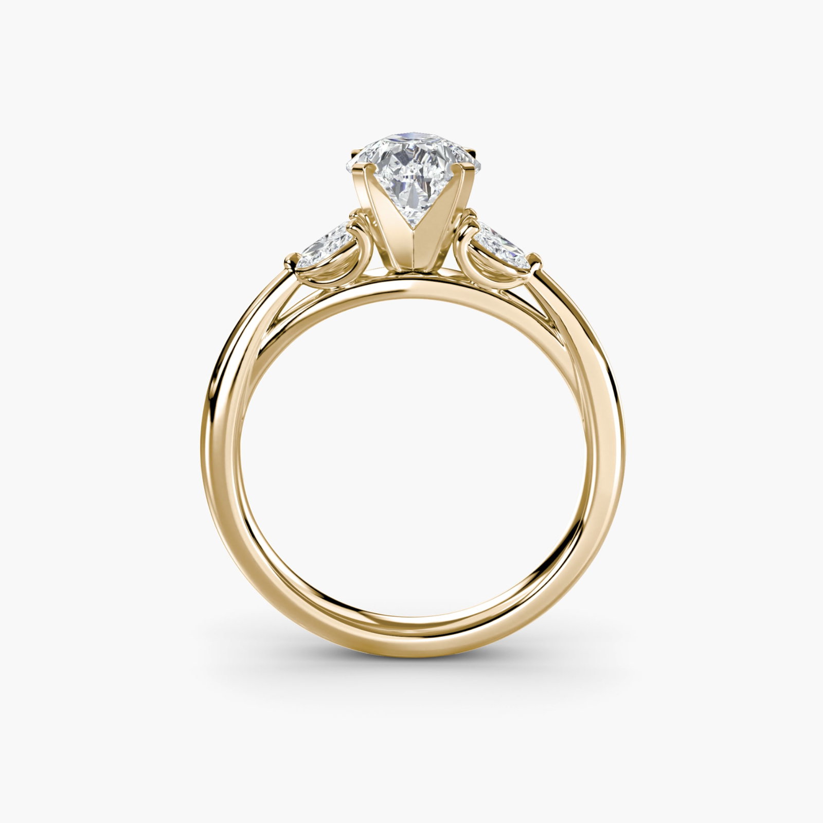Side Stone Pear 18Kt Yellow Gold Ring Setting: Side Stone Pear 18Kt Yellow Gold Ring Setting 18Kt Yellow Gold Pear Ring Setting with Four Lab Grown Side Stones. This elegant ring setting boasts four side stones, totaling 0.43 carats in color and c