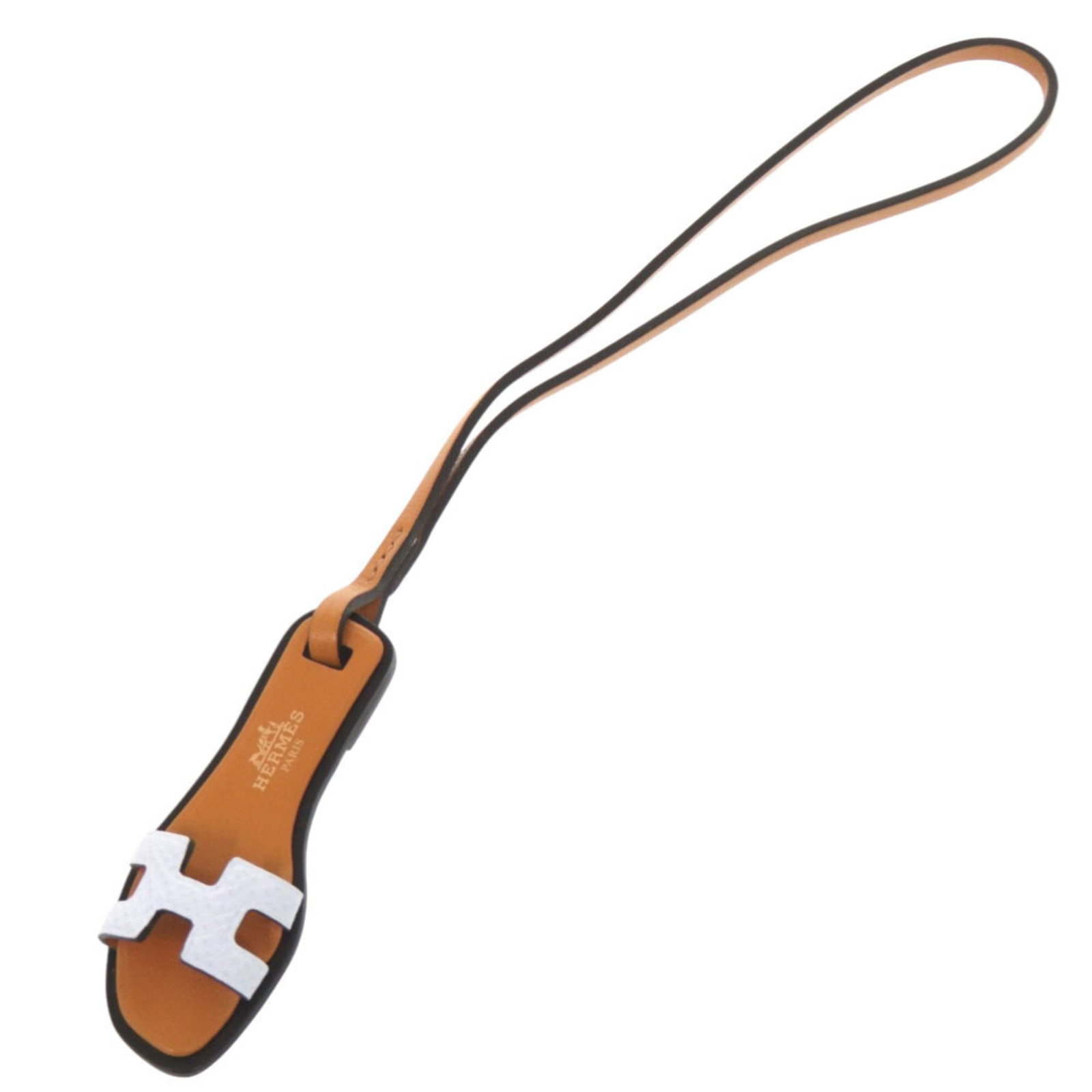 Handbag Charm Leather Epsom Hermes: Handbag Charm Leather Epsom Hermes Epsom leather, a luxurious and durable material, is used to create this handbag charm from the renowned French brand Hermes. Measuring 240mm x 25mm in size, it featu