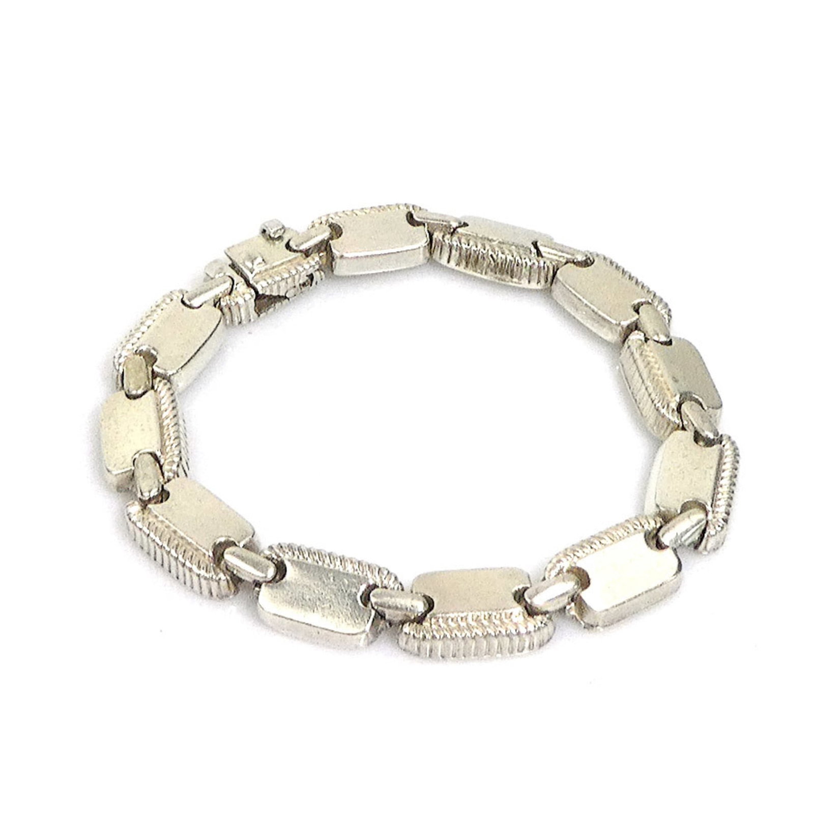 Silver Charm Hermes Bracelet: Silver Charm Hermes Bracelet Silver Charm Hermes Bracelet, 18cm in length, features a silver charm bracelet with a distinctive silver finish. The item bears a signature and is made from high-quality