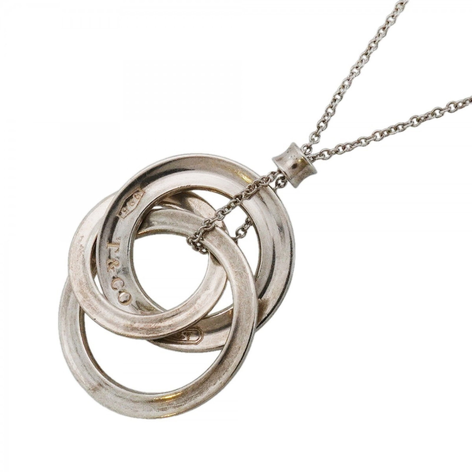 Women's Interlocking Necklace Sterling 925 1837 by Tiffany: Women's Interlocking Necklace Sterling 925 1837 by Tiffany Sterling silver necklace with interlocking design, featuring a 1837 Tiffany mark. The 43.5 cm chain and 25.5mm x 21.8mm pendant make for a