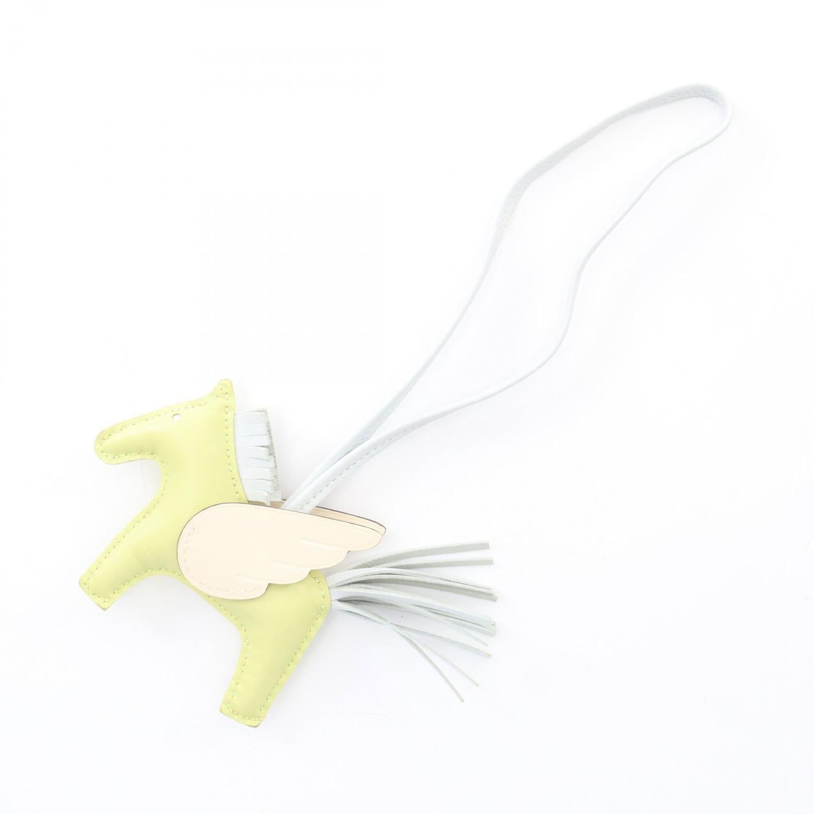 Swift Leather Handbag Charm Hermes Agneau Milo: Swift Leather Handbag Charm Hermes Agneau Milo Swift Leather Handbag Charm by Hermes features Agneau Milo and Swift leather in striking blue, green, and ivory hues. This unique charm showcases the