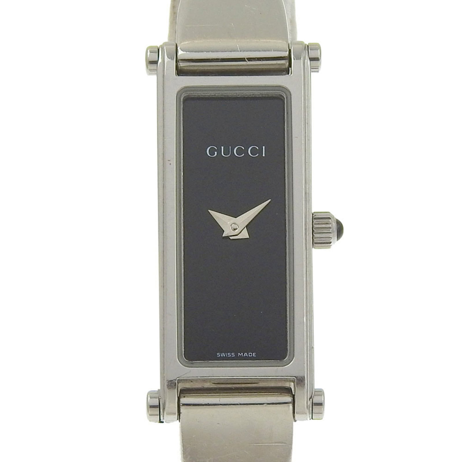 Gucci Wristwatch: Gucci Wristwatch Stainless steel case and band provide a sleek, modern look for the Gucci wristwatch. The black dial stands out against the neutral background, while the quartz movement ensures