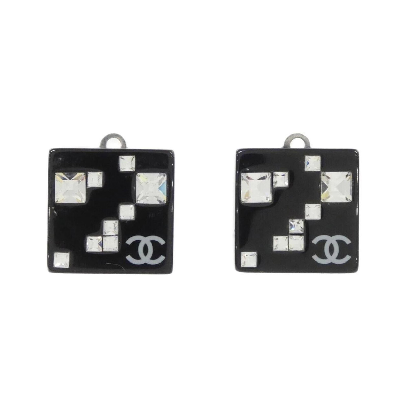 Clip earrings by Chanel: Clip earrings by Chanel Clip earrings by Chanel in sleek black and silver, measuring 16.00mm x 0.63'' square. These minimalist designs showcase the brand's signature style with clean lines and a