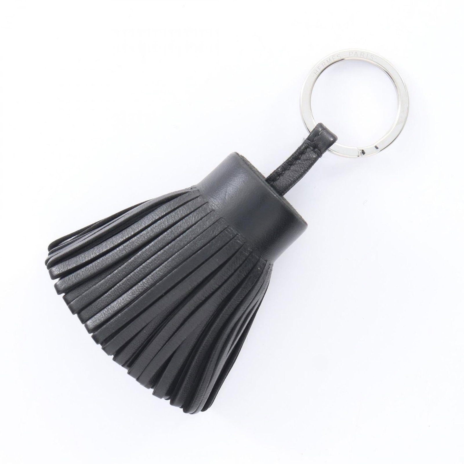 Hermes agneau handbag charm Milo: Hermes agneau handbag charm Milo Agneau Milo handbag charm from Hermes in black. Made from Agneau Milo, this charm showcases the brand's attention to detail and high-quality materials. A sleek and