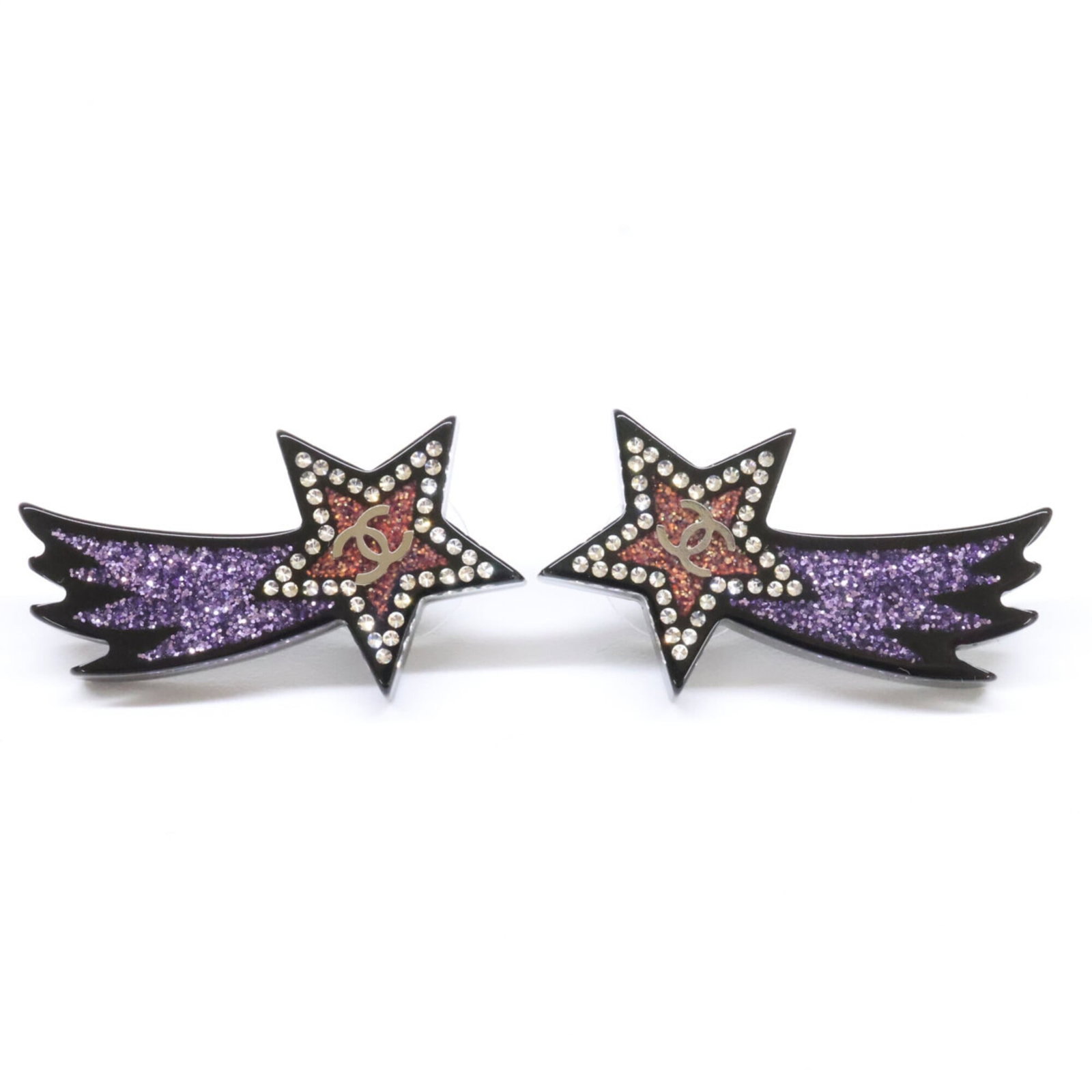 Stud earrings resin by Chanel: Stud earrings resin by Chanel Stud earrings in resin by Chanel, available in black, pink, and purple. The rhinestone accents add a touch of glamour to these sleek, modern designs. Measuring 35mm x 19m
