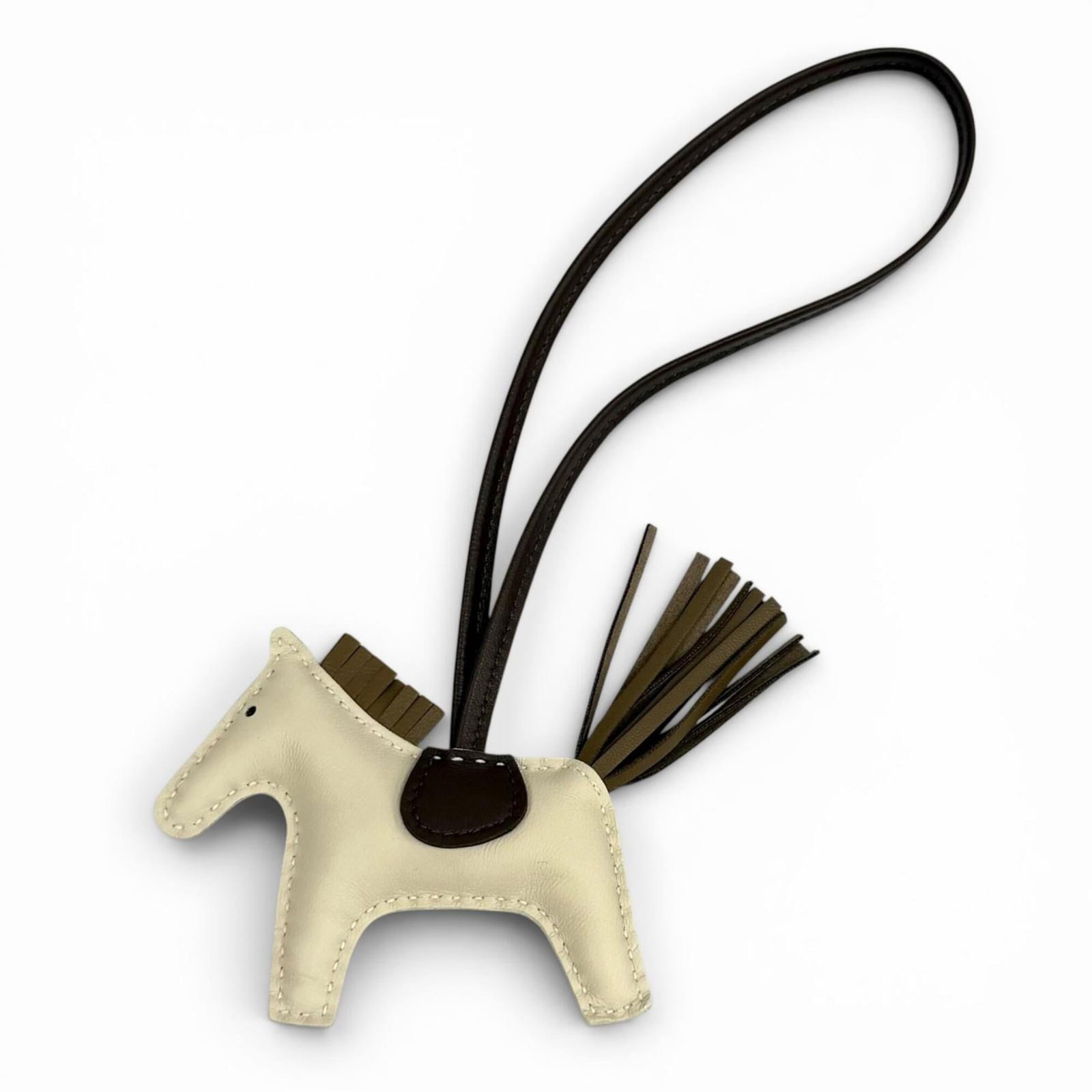 Hermes Handbag Leather Charm: Hermes Handbag Leather Charm Made from high-quality leather, this Hermes handbag charm boasts a sleek design and precise measurements. The charm measures 100mm x 125mm and features the iconic Hermes