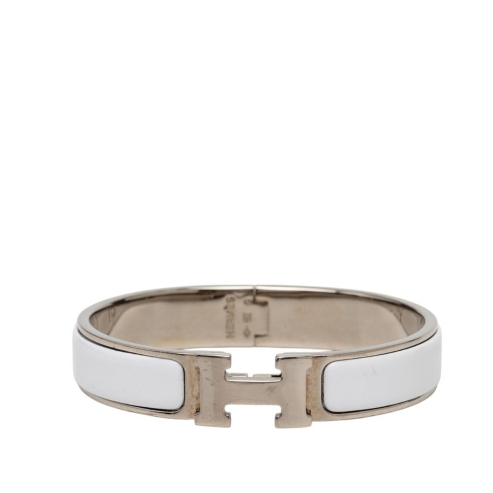 Metal enamel charm bracelet by Hermes: Metal enamel charm bracelet by Hermes Silver and white enamel details adorn a metal charm bracelet from Hermes, measuring 15.5cm in length. This intricate design showcases the brand's signature style