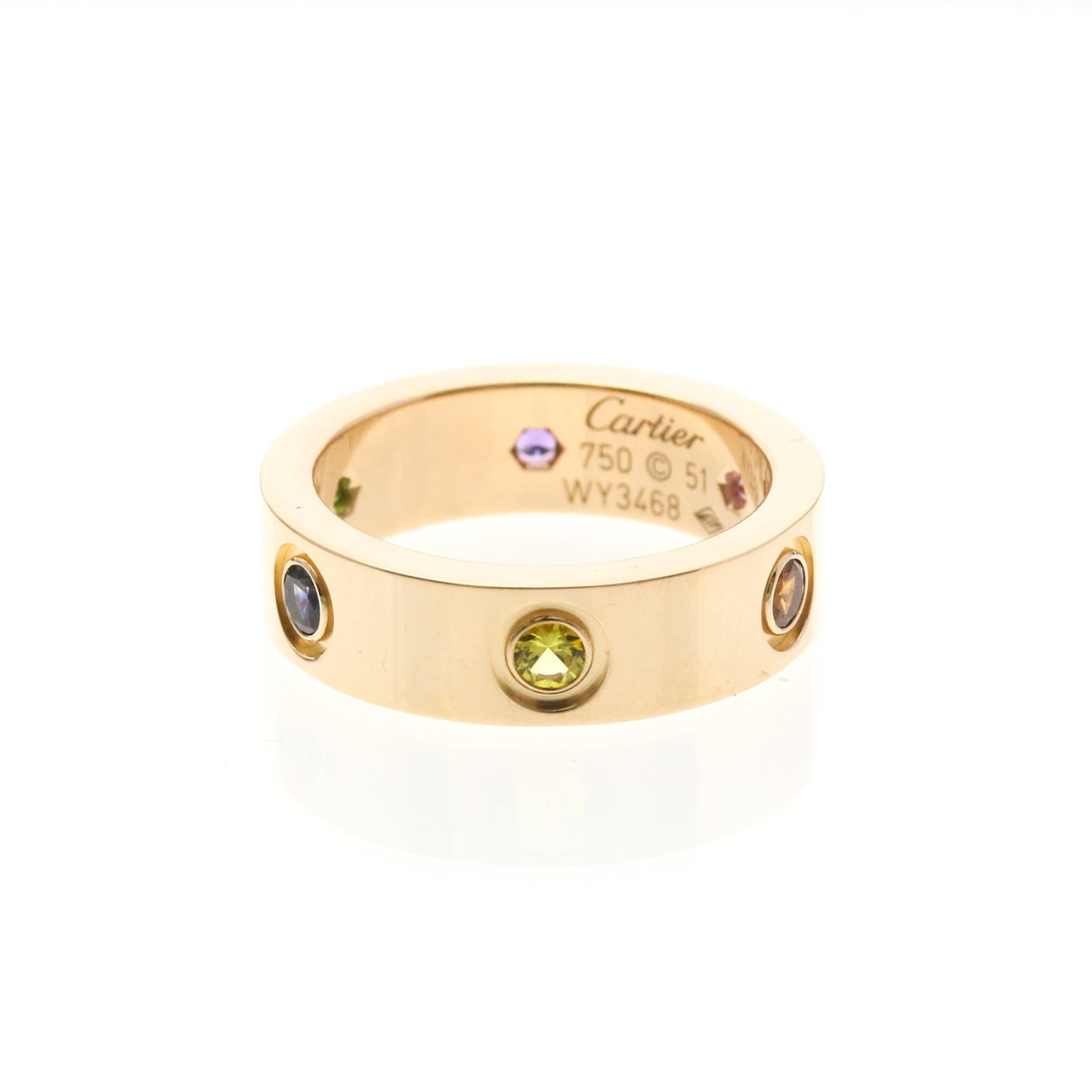 Pink Gold Ring Band Cartier: Pink Gold Ring Band Cartier Pink gold (18K) band ring from Cartier, featuring a unique multistone design with amethyst, garnet, and sapphire stones. This elegant Love Ring showcases the brand's