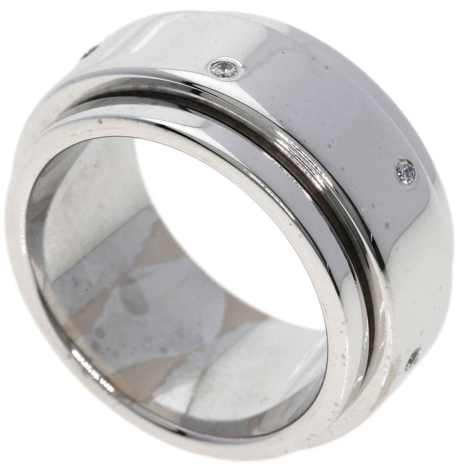 Piaget Band Ring: Piaget Band Ring Piaget Band Ring in White Gold features a diamond stone and 18K metal construction, with a US size 7 and JP size 14 fit. Weighing 17g, this band ring measures 10.7mm in width. Comes