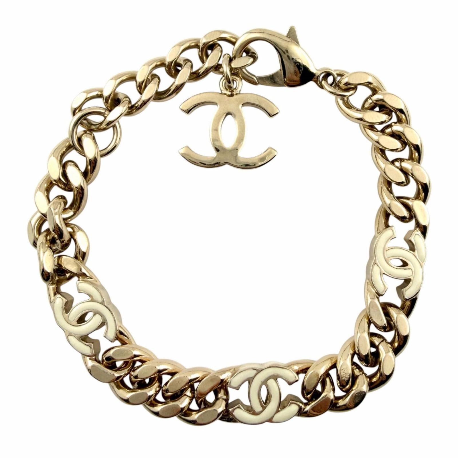 Charm by Chanel: Charm by Chanel Charm by Chanel features a white charm with a stone size of 1.3cm x 1.7cm, set on a 22.5cm / 8.85'' length bracelet. The item bears a signature from the artist. This charm is part of