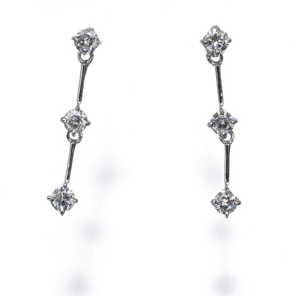 Diamond 0.15Ct/ 0.15Ct 3P Drop Earrings 18K 750 White Gold: Diamond 0.15Ct/ 0.15Ct 3P Drop Earrings 18K 750 White Gold 18k white gold drop earrings feature two natural diamonds totaling 0.15ct each, suspended from delicate drops. The 18k metal purity and