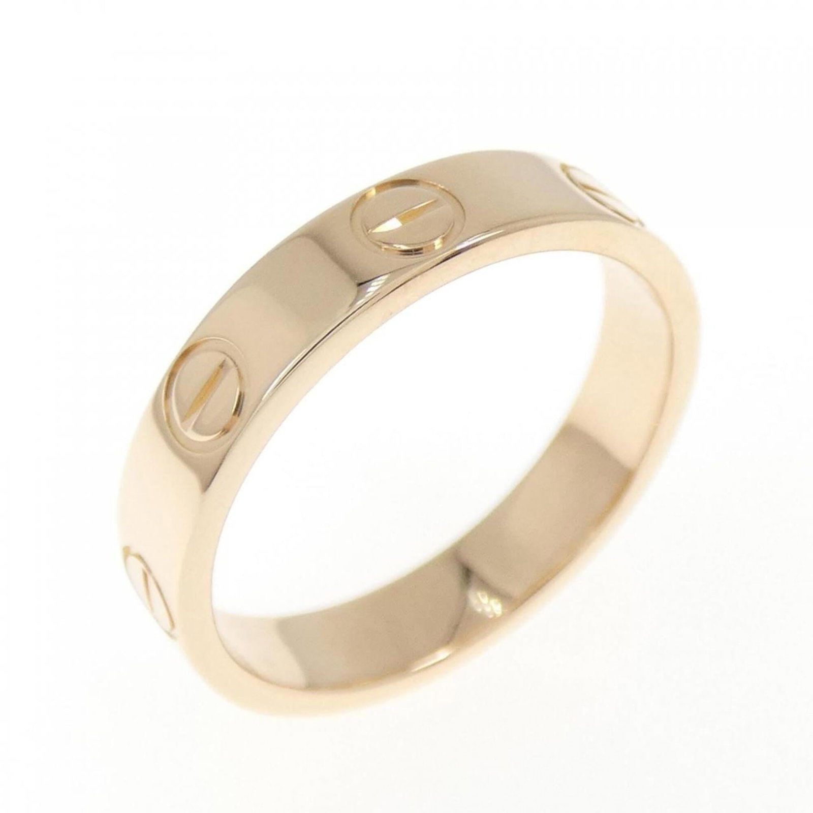 Pink Gold Ring Band Cartier: Pink Gold Ring Band Cartier Pink Gold Ring Band Cartier - A stunning piece from the renowned French luxury brand, featuring an 18K pink gold band with intricate details. This elegant ring measures a