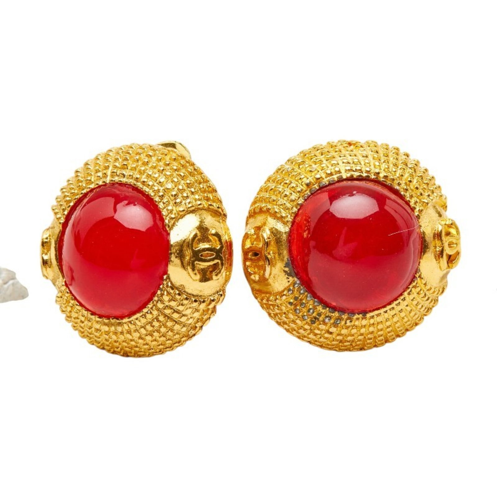Chanel Clip Earrings Gold Plating: Chanel Clip Earrings Gold Plating Gold-plated clip earrings from Chanel, featuring a sleek and modern design with a touch of luxury. The earrings boast a striking gold finish with subtle red accents,